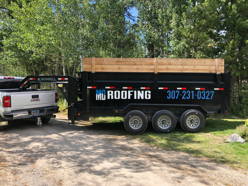 Construction trailer with MD Roofing logo