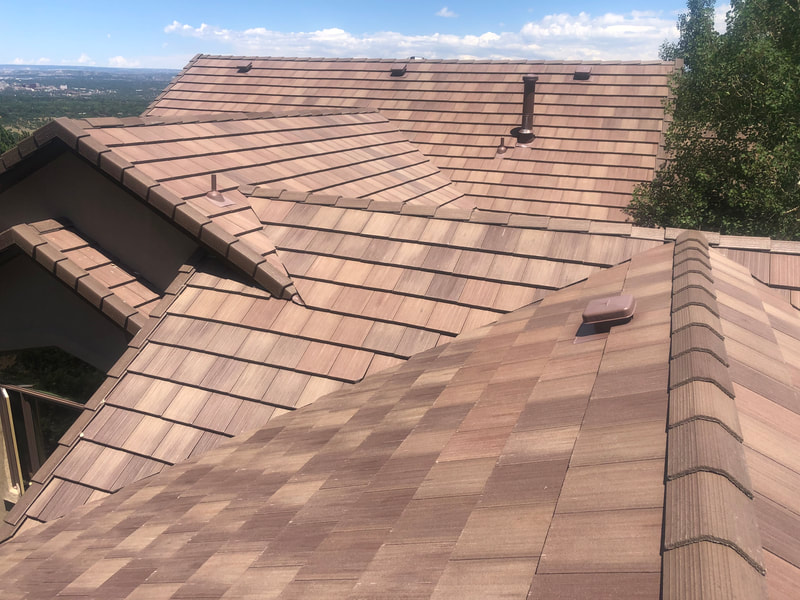 Beautiful roof covered in brown shingles